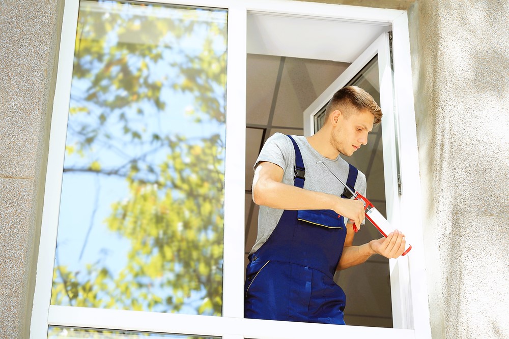 worker installing window 