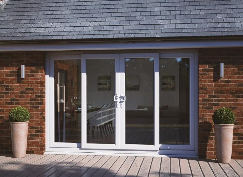 Modern white French patio doors on brick home exterior